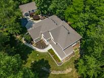 Aerial view of two-story house nestled in a wooded area at 1104 W Greencastle Road, Mooresville, IN 46158