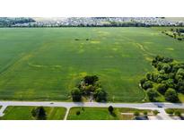Aerial view of house nestled in expansive farmland, offering privacy and tranquility at 3910 N State Road 135, Franklin, IN 46131