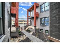 Brick building courtyard with walkway, landscaping, and gated entrance at 723 N Cleveland St, Indianapolis, IN 46202