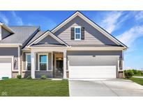 Gray two-story home with white garage door and front porch at 4123 Palermo Garden Dr, Indianapolis, IN 46239