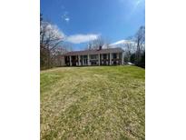 Ranch house with brick facade and large yard at 10835 Charlemagne Dr, Indianapolis, IN 46259