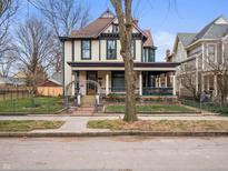 Charming two-story home with a welcoming front porch and landscaped yard at 1507 Broadway St, Indianapolis, IN 46202