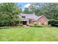Brick home with large yard and mature trees at 8801 Traders Lndg, Brownsburg, IN 46112