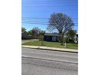Newly built home with a blue exterior, situated on a grassy lot at 1469 W County Line Rd, Greenwood, IN 46142