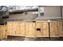 Neatly landscaped home with a new wooden fence and gate at 4237 Foxglove Trce, Indianapolis, IN 46237