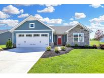 Blue and gray house with stone accents and a two-car garage at 6941 E Bean Blossom Dr, Camby, IN 46113
