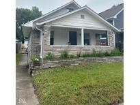 Charming single-story home with stone facade and landscaped yard at 531 N Alton Ave, Indianapolis, IN 46222