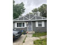 Gray house with white trim and a security door at 533 Lynn St, Indianapolis, IN 46222