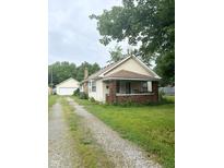 House exterior with driveway, garage and front yard at 1062 N Berwick Ave, Indianapolis, IN 46222