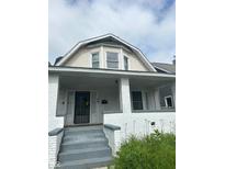 Two-story house with white brick and a covered porch at 20 N Pershing Ave, Indianapolis, IN 46222