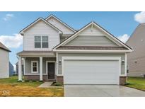 Two story house with gray siding and a two-car garage at 2135 Rosemont Dr, Columbus, IN 47201