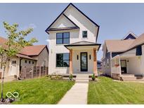 Modern farmhouse exterior with a welcoming front porch at 1544 Hoyt Ave, Indianapolis, IN 46203