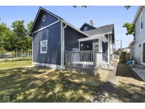 Blue house with wooden deck and playground view at 249 N Beville Ave, Indianapolis, IN 46201