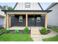 Charming house with a covered porch and landscaping at 1134 St Peter St, Indianapolis, IN 46203