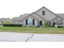 Stone front home with landscaping and green lawn at 2148 Heather Glen Way, Franklin, IN 46131