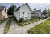 Small white house needing renovation, in need of repairs at 2327 Hoyt Ave, Indianapolis, IN 46203
