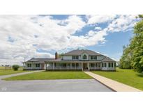 Two story home with large backyard, front porch, and attached garage at 3917 N 525 W, Fairland, IN 46126