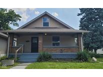 Charming bungalow with front porch at 41 S Sherman Dr, Indianapolis, IN 46201