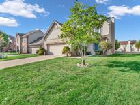 Two-story house with a spacious front yard and a two-car garage at 7054 Lavender Ct, Indianapolis, IN 46237