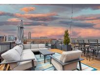 Enjoy city views from this rooftop deck complete with seating and dining areas at 610 N Park Ave, Indianapolis, IN 46204