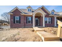 Brick house with a beige front door and walkway at 7936 Beaumont Green Pl, Indianapolis, IN 46250