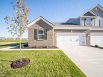 Brick front exterior of a charming ranch-style home with a two-car garage at 6254 Rhinecliff Dr, Whitestown, IN 46075