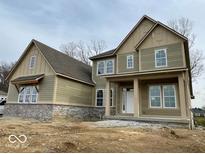 Two-story craftsman style home with gray siding and brick accents at 11327 Briargate Dr, Fishers, IN 46040