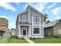 Modern two-story home with gray siding and metal roof at 220 Sanders St, Indianapolis, IN 46225