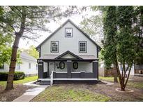 Charming two-story house with gray and white siding at 618 N Gladstone Ave, Indianapolis, IN 46201