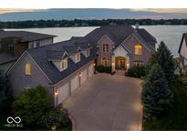 Lakefront property with large brick house and 3-car garage at 9088 Nautical Watch Dr, Indianapolis, IN 46236
