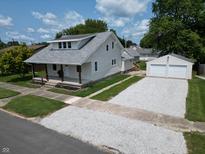 Aerial view of a charming bungalow with a detached garage at 2708 S A St, Elwood, IN 46036