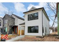 Modern two-story home with white siding and black window frames at 1647 Sheldon St, Indianapolis, IN 46218