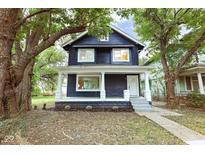 Charming two-story home with a welcoming porch at 3031 N New Jersey St, Indianapolis, IN 46205