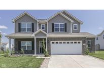 Two-story house with gray siding, brick accents, and a two-car garage at 2277 Maple Stone Ln, Greenwood, IN 46143