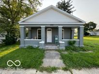 Gray house with white trim and a front porch at 1202 S Shipley St, Muncie, IN 47302