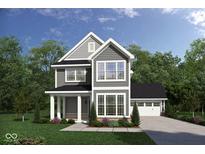 Two-story house with gray siding, brick accents, and a two-car garage at 134 W Franklin St, Shelbyville, IN 46176