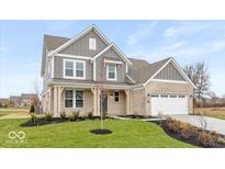 Charming two-story home with a landscaped yard and attached garage at 1098 Gatewick Ct, Greenwood, IN 46143