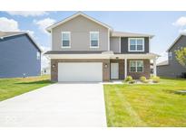 Two-story home with brick facade and attached garage at 91 Booth St, Whiteland, IN 46184