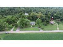 Aerial view of house, barn, and church on large lot at 4463 W 700 S, Trafalgar, IN 46181