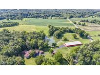 Aerial view of property showing home, pond, and outbuildings at 7601 S 700 W, Morgantown, IN 46160