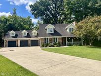 Two-story home with a three car garage and a large yard at 303 Wellington Overlook, Noblesville, IN 46060