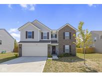 Two-story home with brick and siding exterior at 10125 Caprock Canyon Dr, Indianapolis, IN 46229