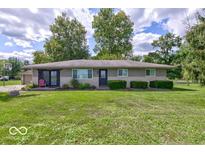 Brick ranch house with attached garage and large yard at 17128 Towne Rd, Westfield, IN 46074