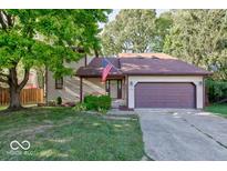 Two-story house with a large yard and attached garage at 7932 Eagle Valley Pass, Indianapolis, IN 46214