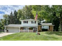 Ranch style home with attached garage and spacious yard at 815 E Post Rd, Anderson, IN 46012