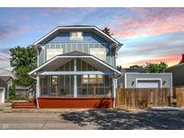 Two-story house with a front porch and detached garage at 1938 E 11Th St, Indianapolis, IN 46201