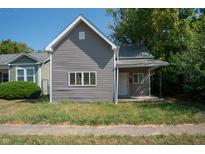 Gray siding house with front porch at 2363 N Gale St, Indianapolis, IN 46218