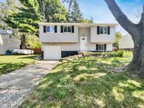 House exterior with landscaping and driveway at 2647 Sheffield Dr, Indianapolis, IN 46229
