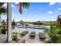 Stunning pool and patio overlooking the lake at 10580 Geist View Dr, Fishers, IN 46055