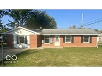 Brick ranch house with a well-kept lawn at 6733 S Cross St, Pendleton, IN 46064